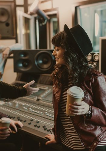 group of young musicians spending time at recording studio