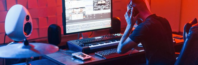 Guy have a job with project and mixing music indoors in the studio.